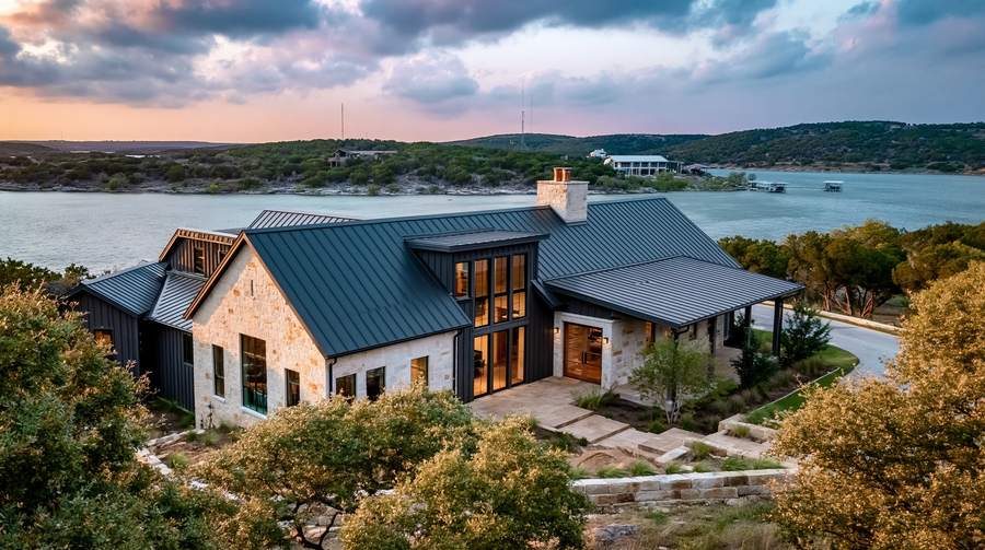 Standing-seam metal roof on a Possum Kingdom lakefront home at dusk